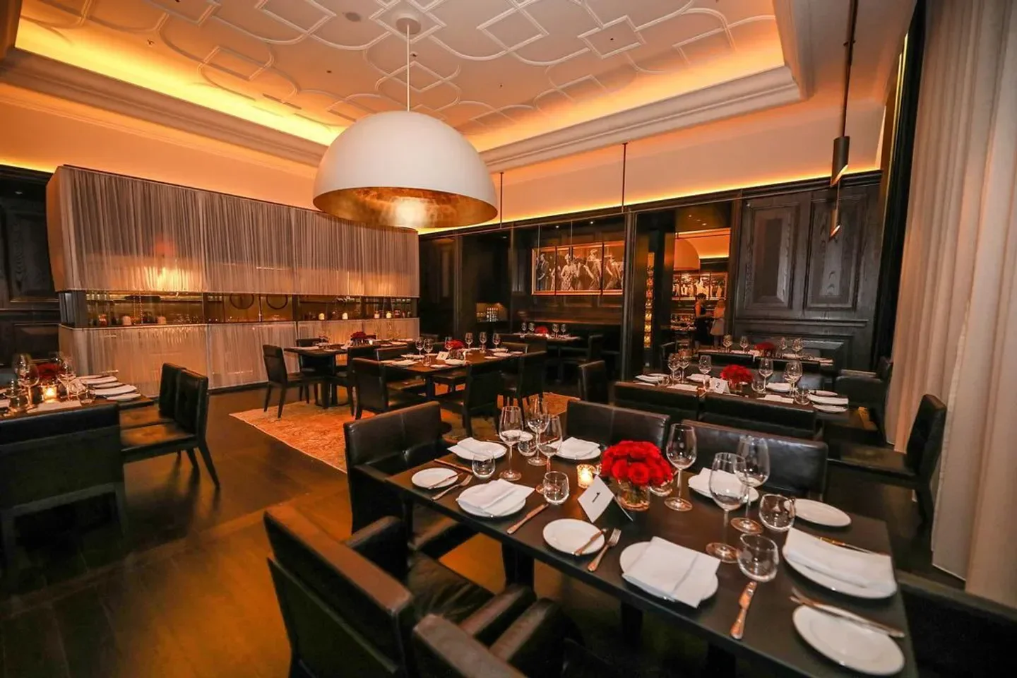 Oak Room Abu Dhabi restaurant interior with elegant tables set for dining.