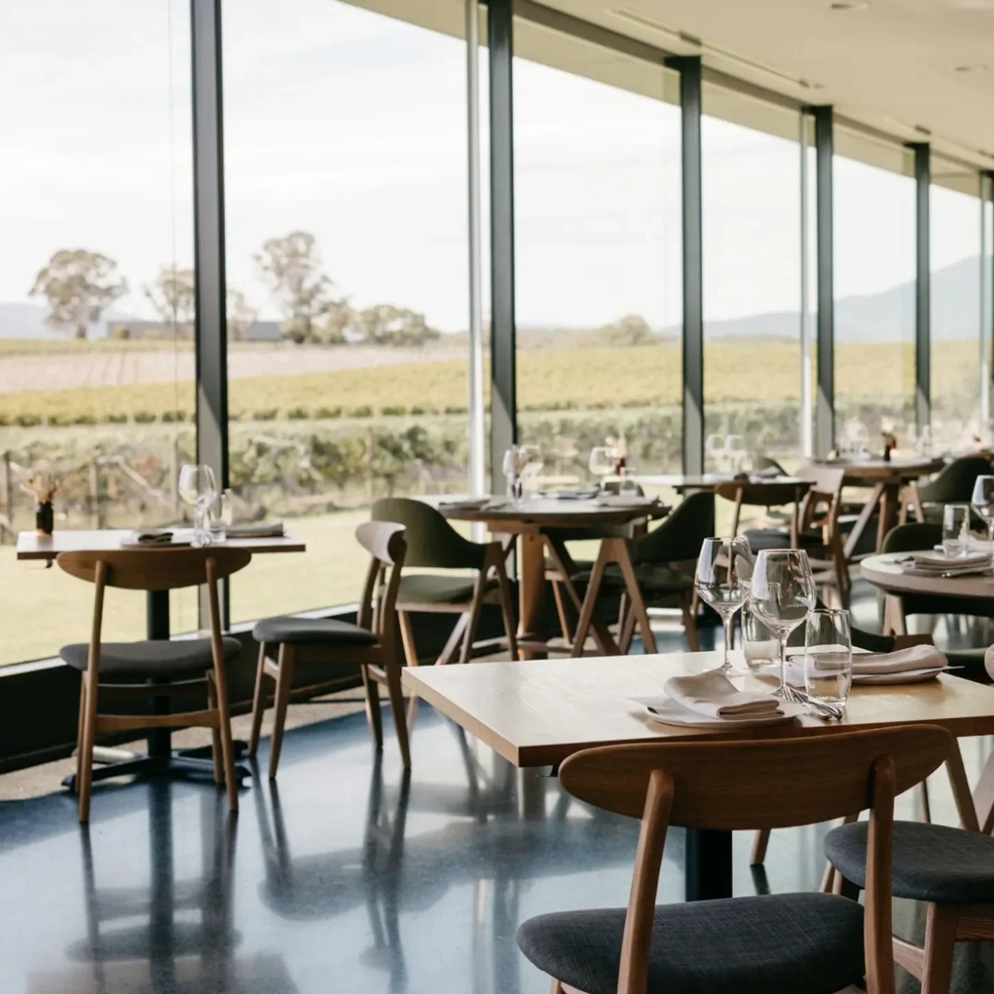 Oakridge restaurant in Yarra Valley with tables set for dining and vineyard views