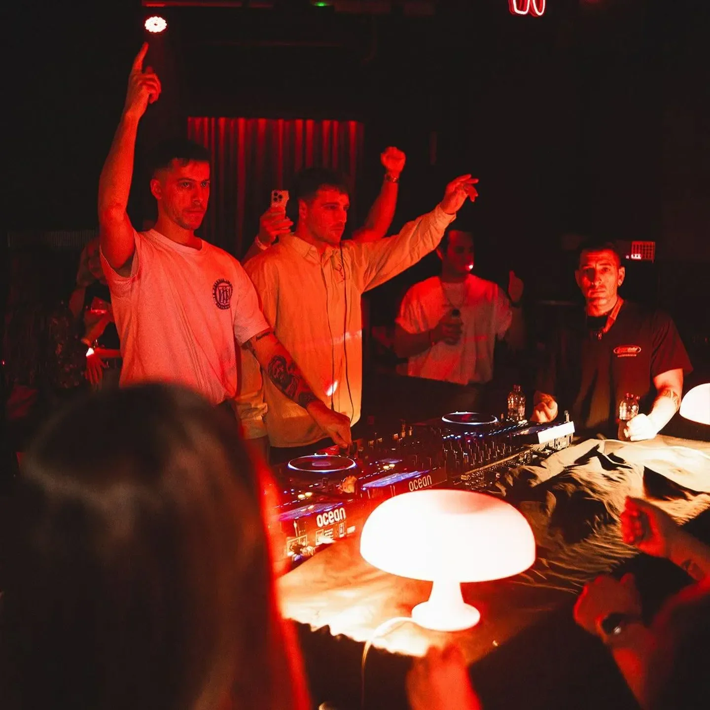 Energetic night at Ocean Club Barcelona with a DJ and vibrant atmosphere.
