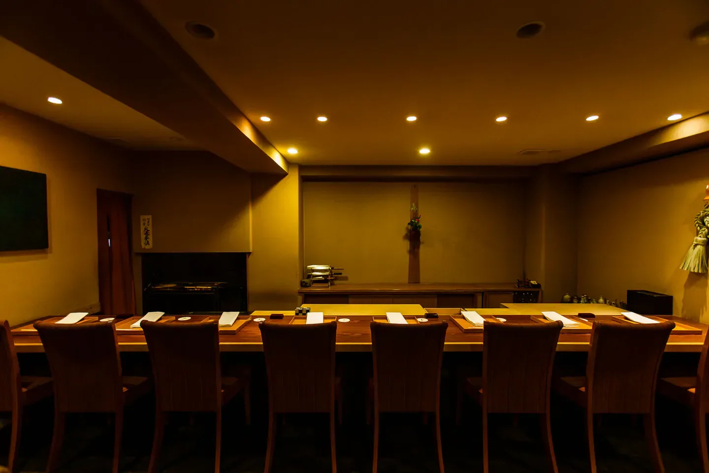 Interior of Oimatsu Kitagawa restaurant in Osaka, Japan, featuring wooden dining table.