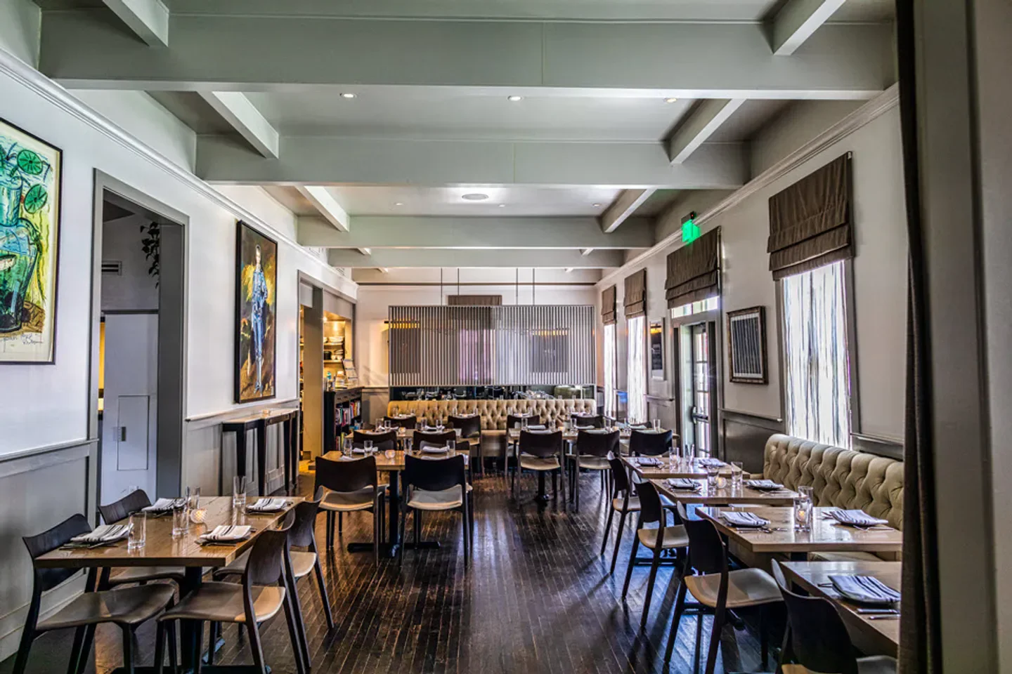 Interior of Olamaie restaurant in Austin, Texas, with elegant dining tables and decor.