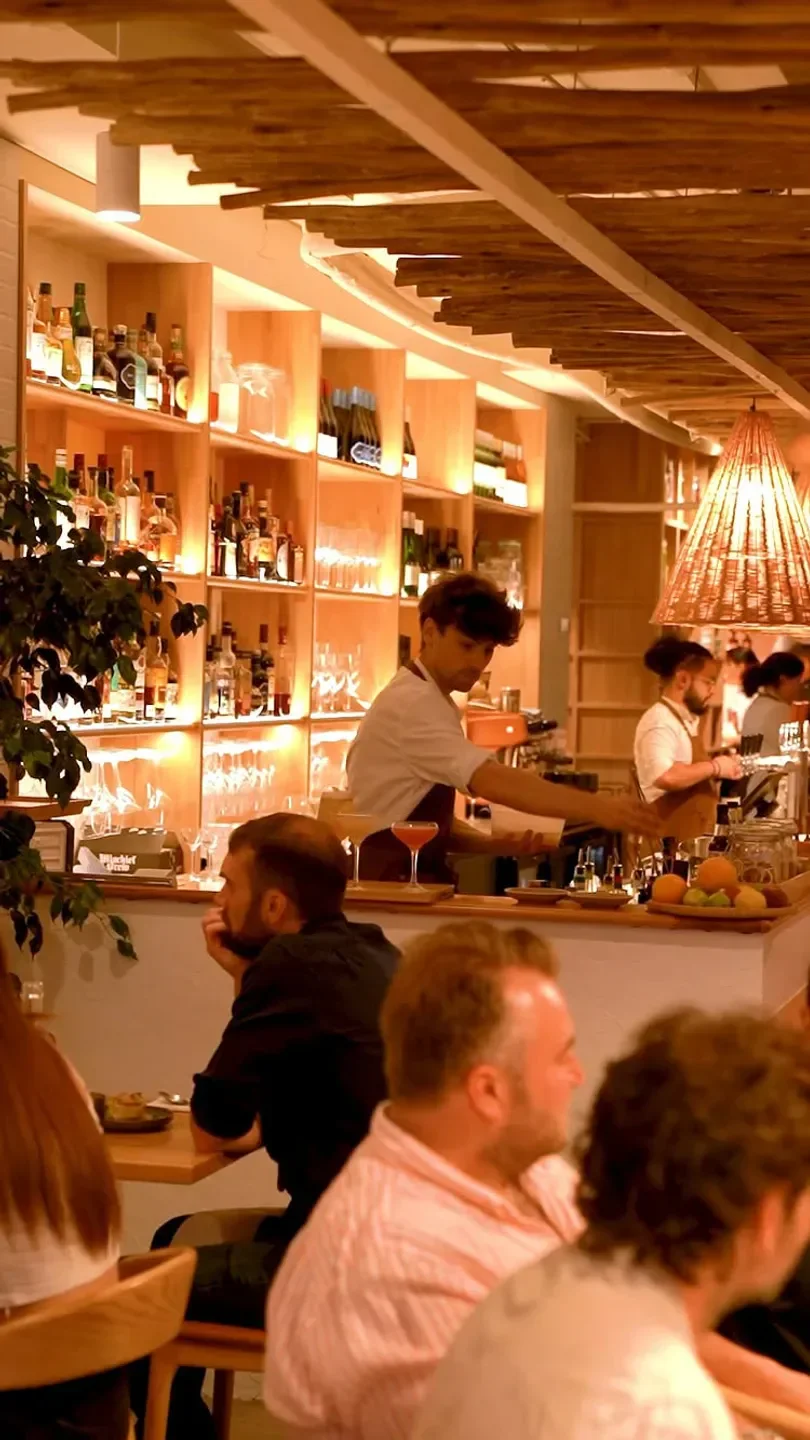 Olive Restaurant in Adelaide: stylish interior with bar staff preparing drinks for customers