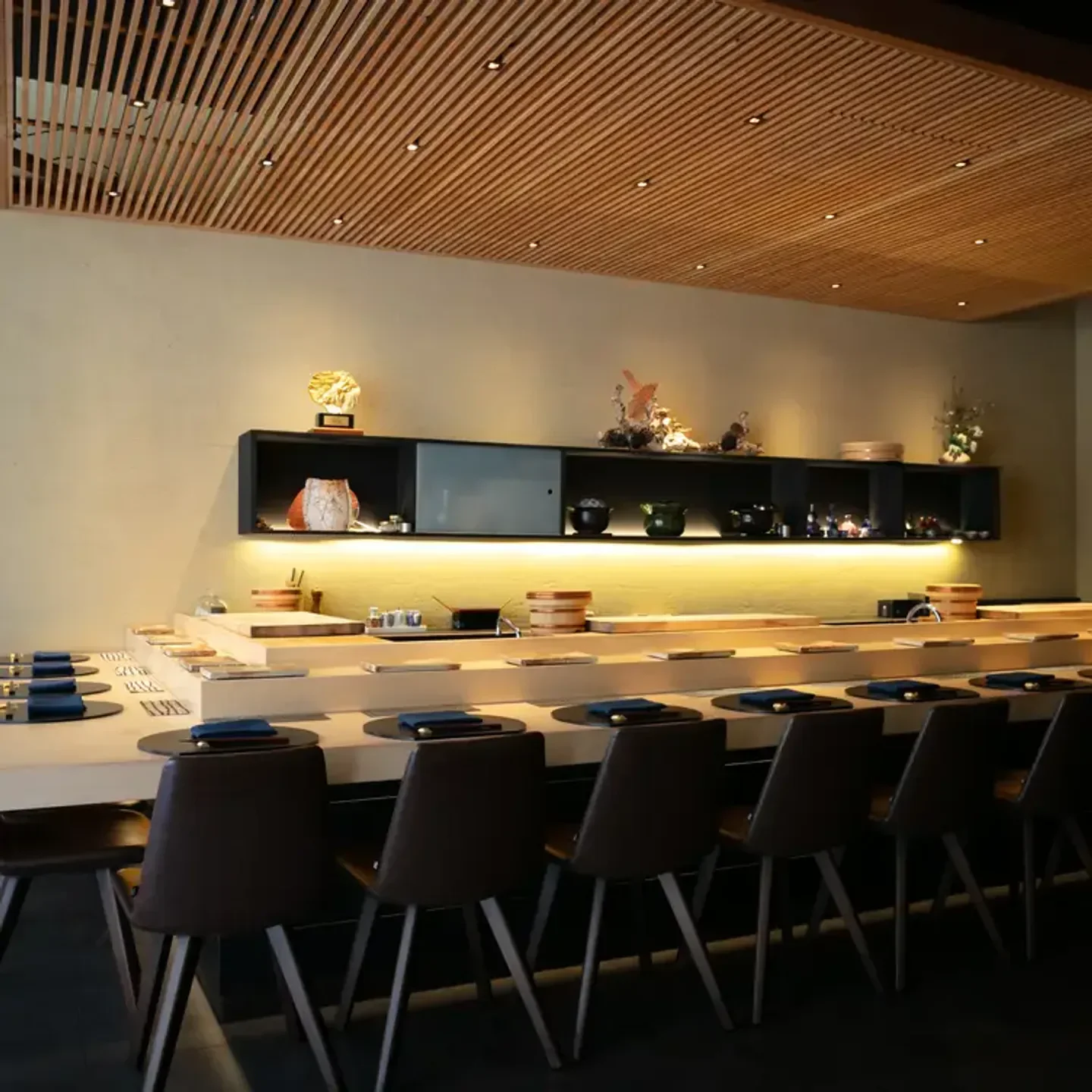 Interior view of Omakase restaurant in San Francisco with wooden details and seating.