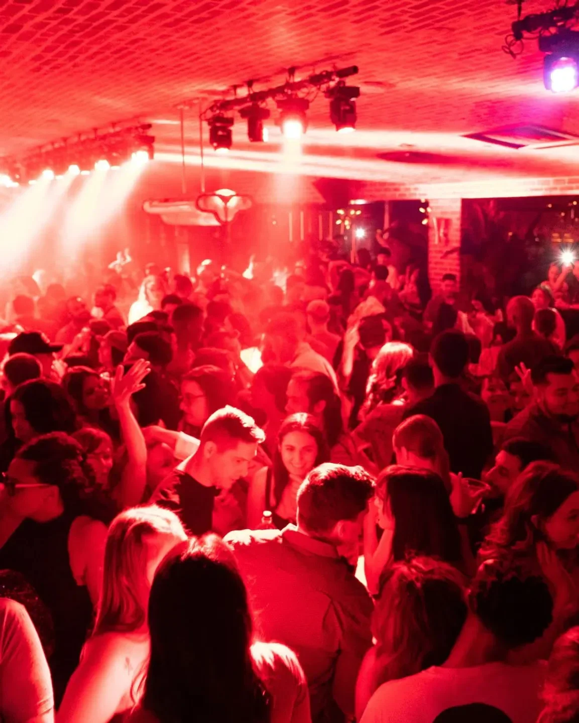 Energetic crowd enjoying a night out at On The Record nightclub in Las Vegas.