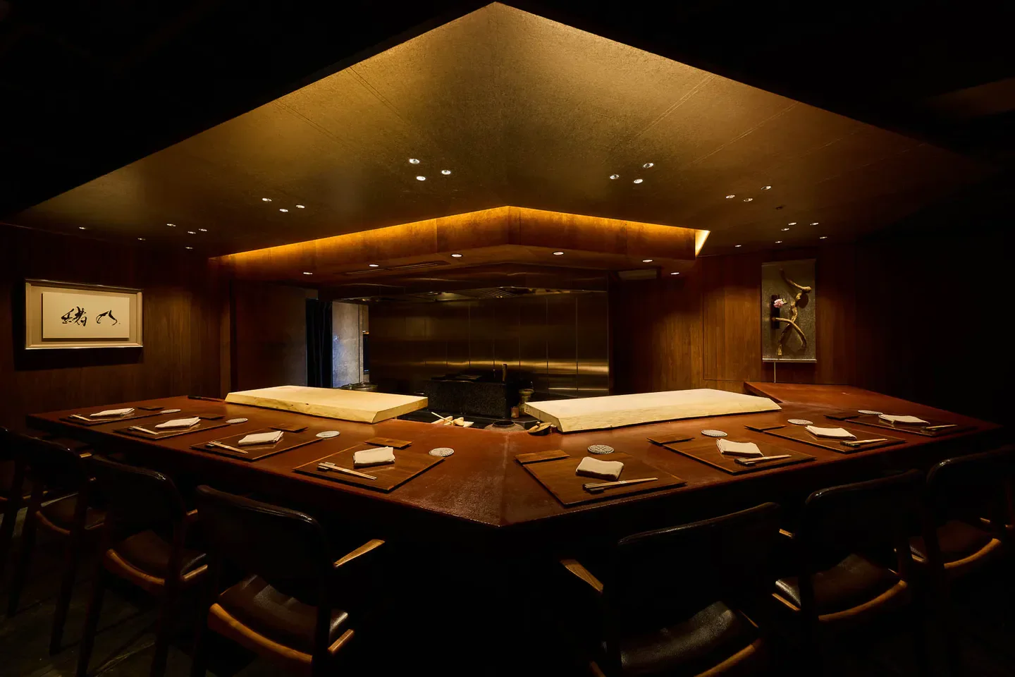Interior of Ono restaurant in Osaka, featuring wooden tables and intimate lighting.