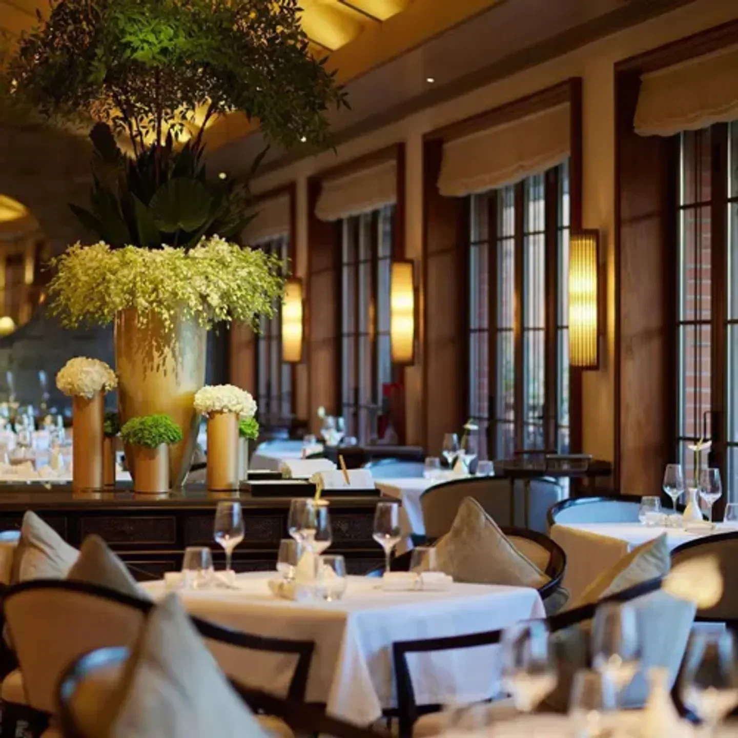 Elegant dining at Oriental Sense & Palate restaurant in Shanghai, featuring floral decor.