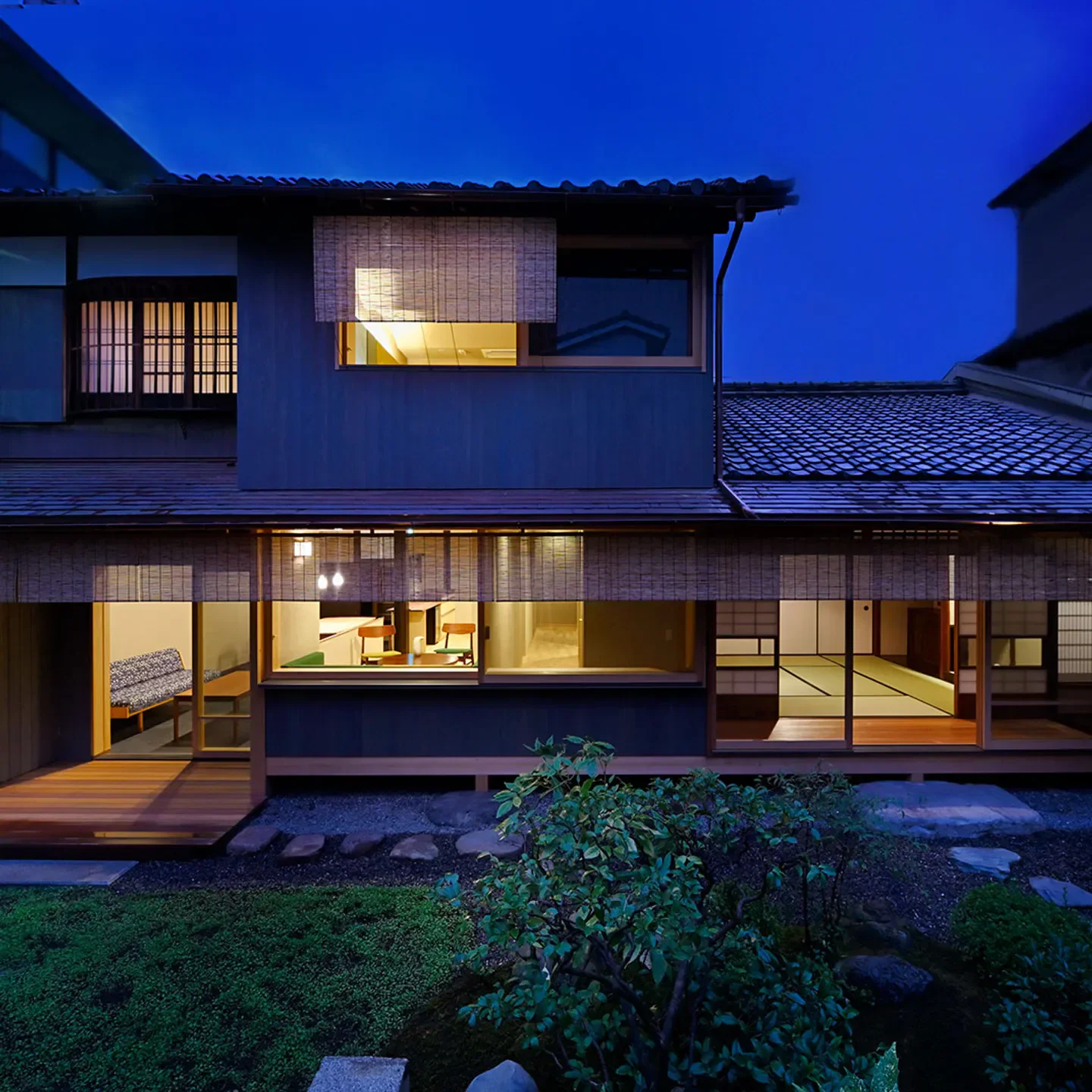 Exterior view of Oryori Mitsuyasu restaurant in Kyoto at dusk, featuring Japanese architecture.