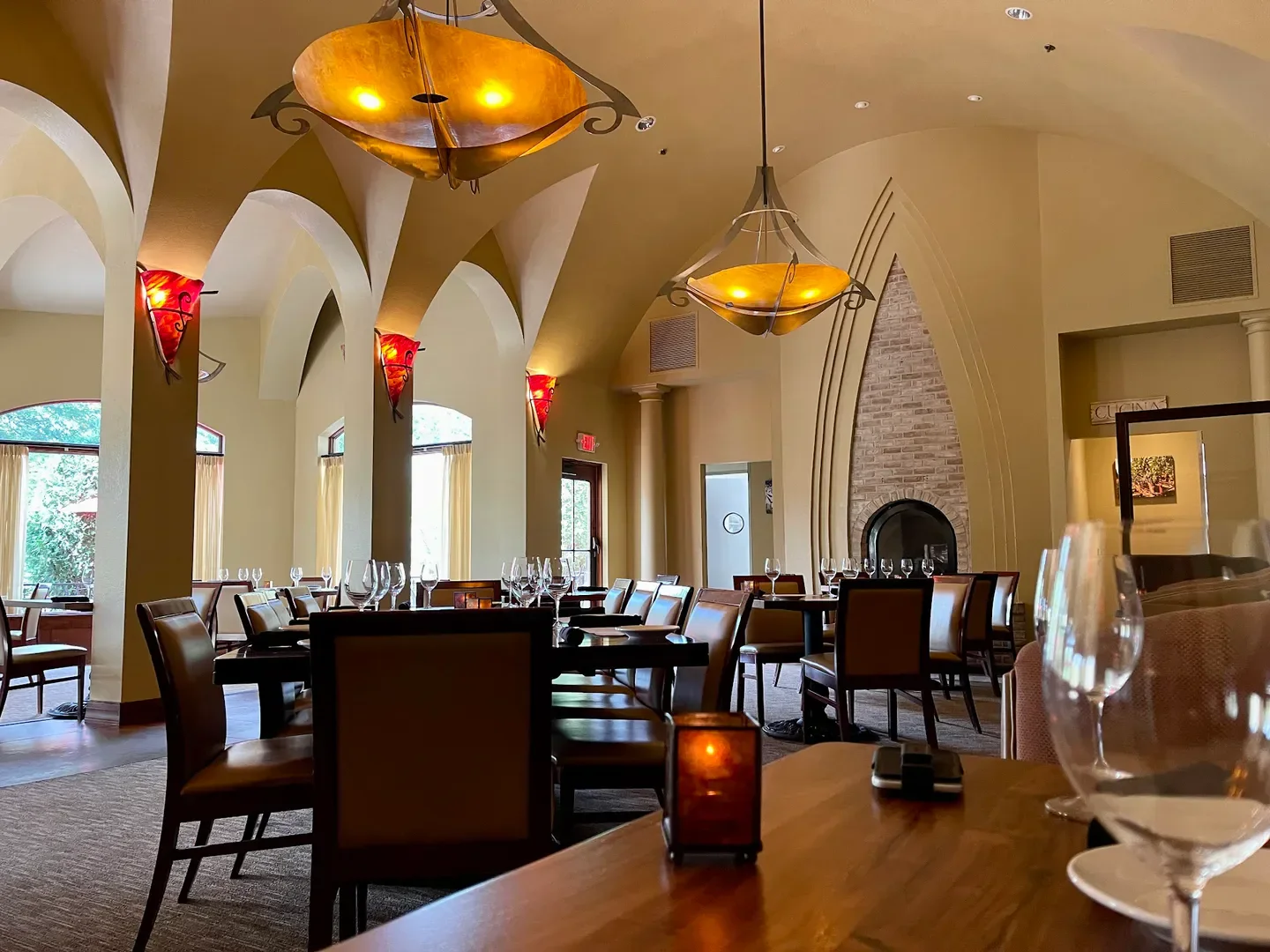 Interior of Osteria I Nonni restaurant in Minneapolis, featuring a dining area with arches.
