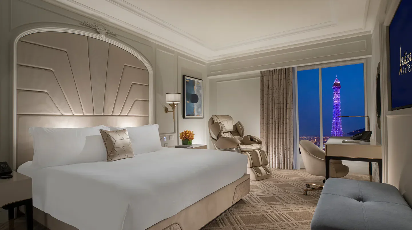 Elegant bedroom at Paiza Lofts in Macau with Eiffel Tower view at night