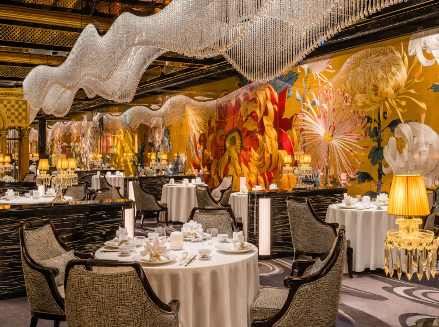 Elegant dining room at Palace Garden in Macau, featuring floral decor and chandeliers