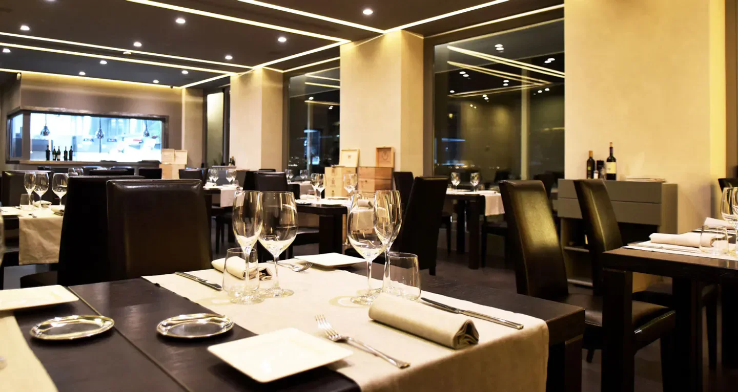 Elegant dining room interior at Palazzo Petrucci restaurant in Napoli, Italy.