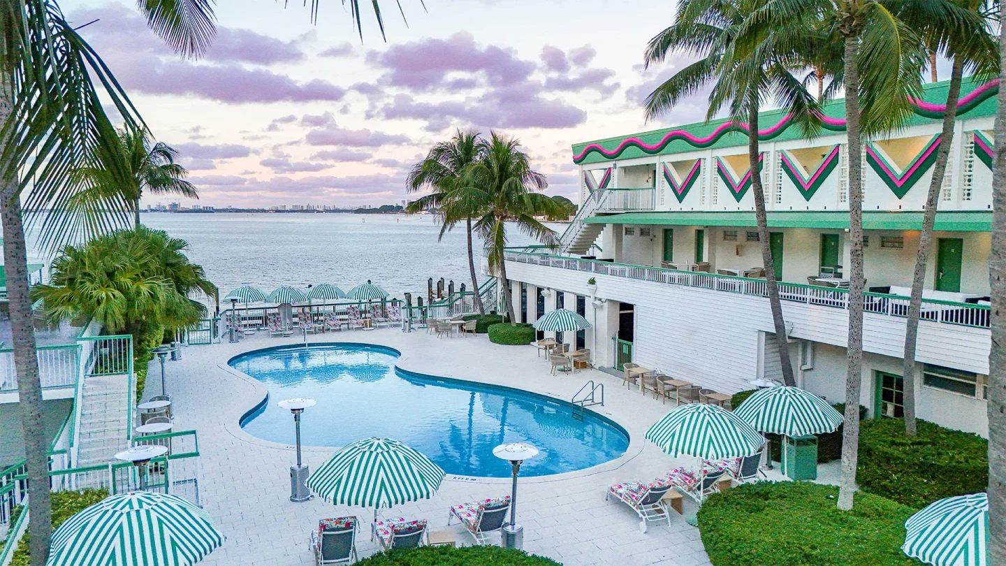 Palm Tree Club Miami offers a vibrant poolside retreat with tropical palm trees and bay views.