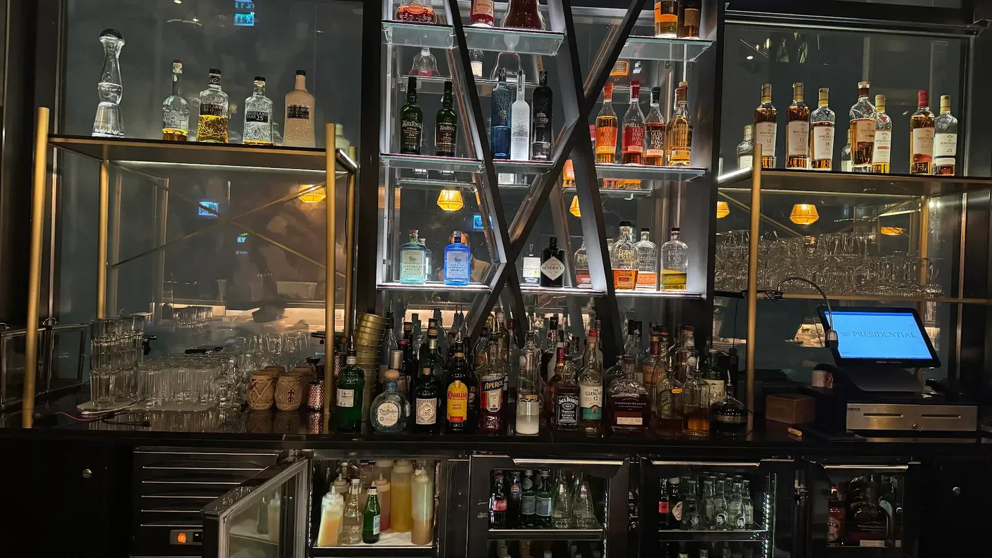 Well-stocked bar at Panorama Sky Bar in Warsaw, featuring a wide selection of liquors.