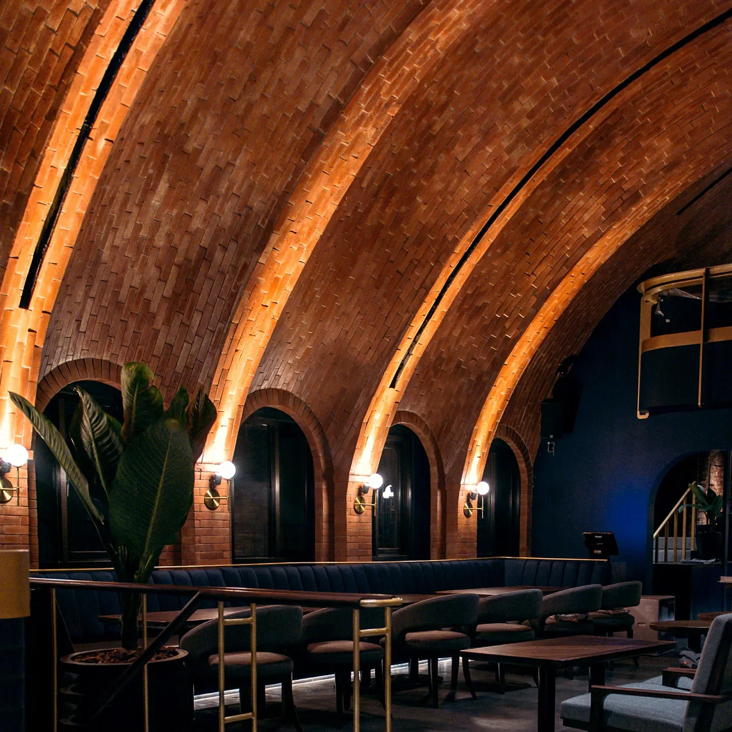 Interior of PANTJA restaurant in Jakarta with brick ceiling and stylish seating.