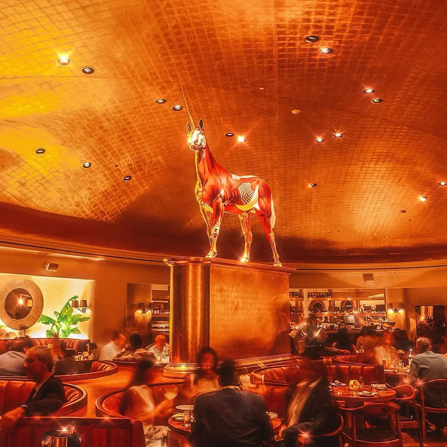 Interior of Pao by Paul Qui in Miami Beach, featuring the iconic unicorn sculpture.