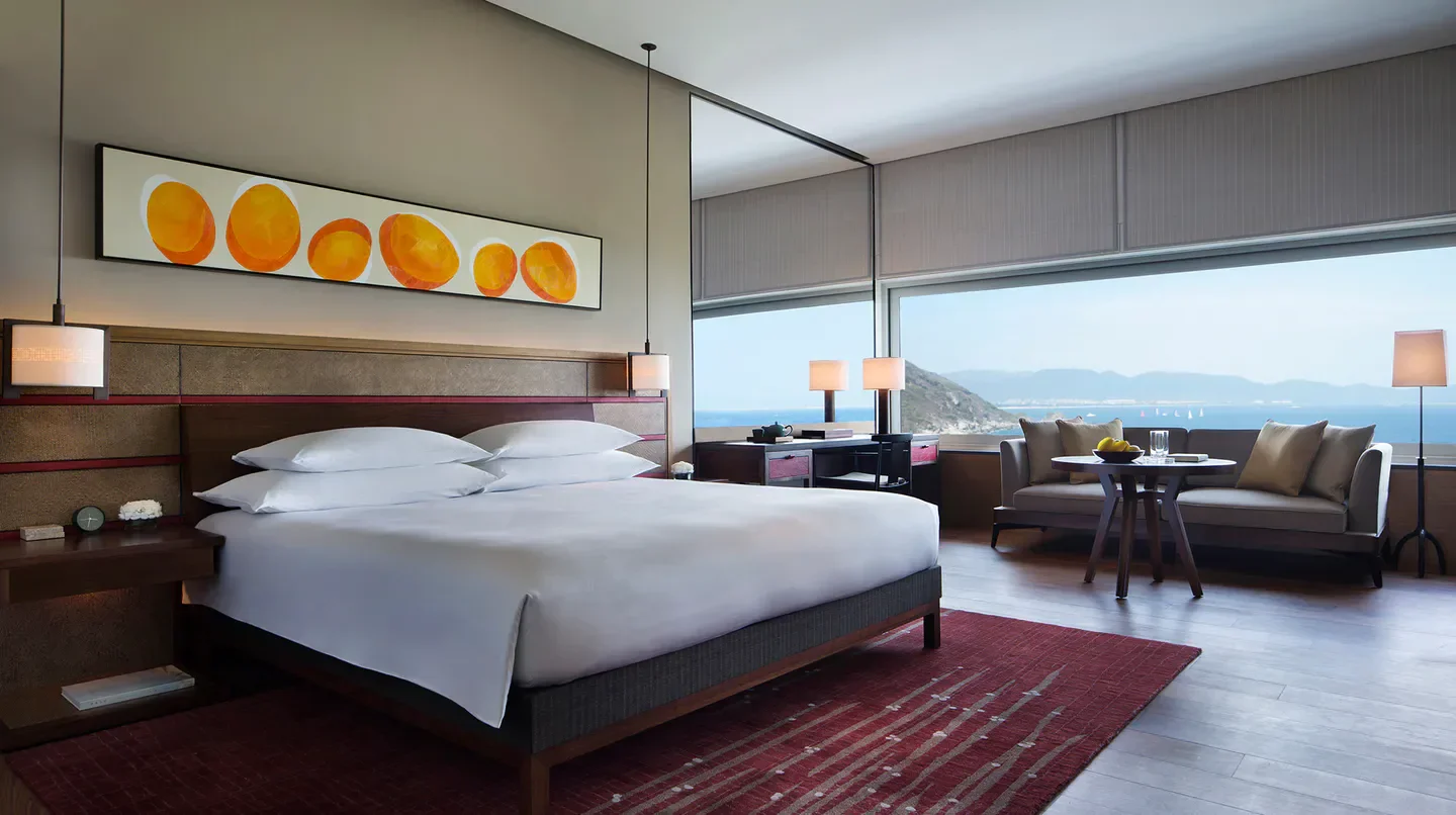 Elegant bedroom at the Park Hyatt Sanya Sunny Bay Resort, offering stunning ocean views in Sanya.
