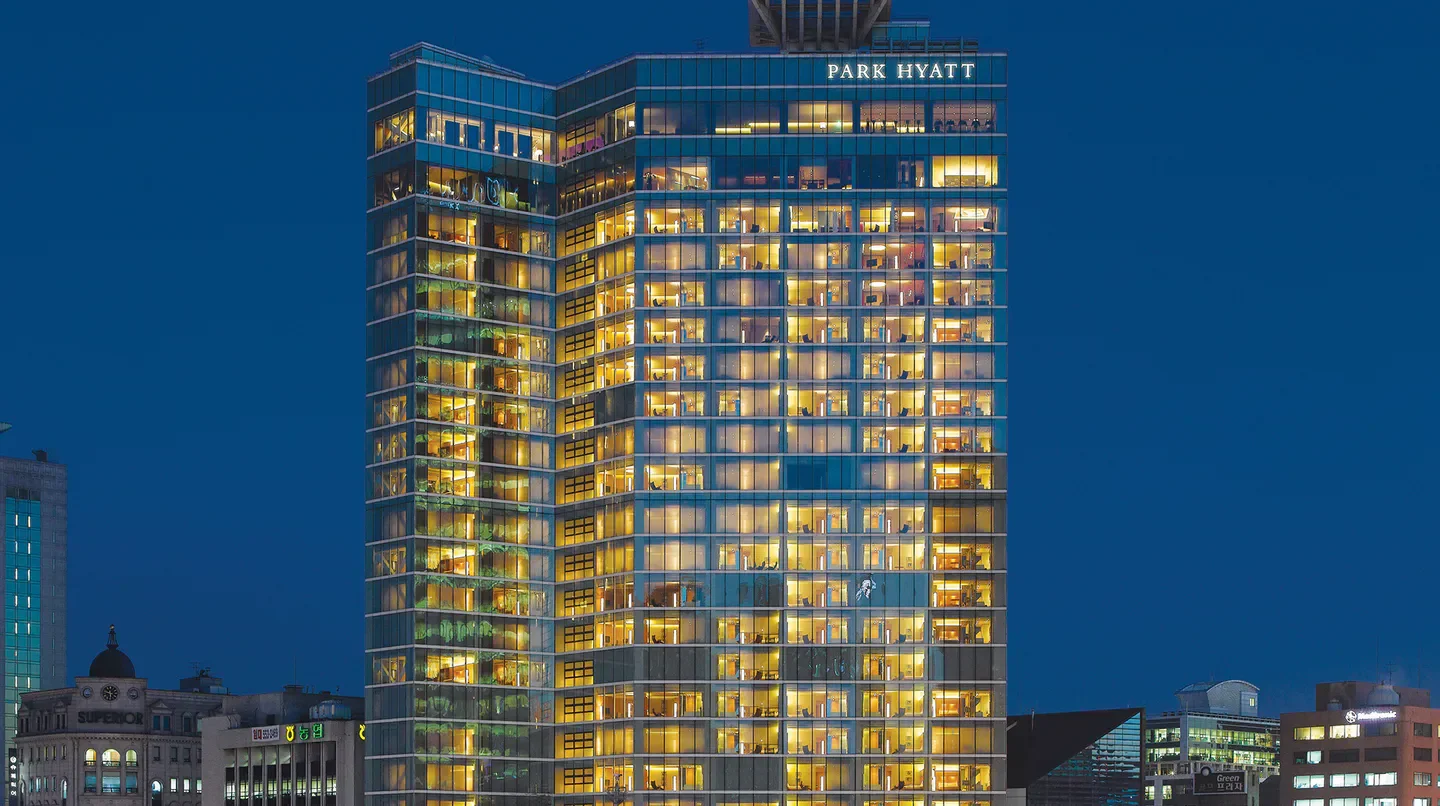 Park Hyatt Seoul hotel illuminated at night in Seoul, South Korea.