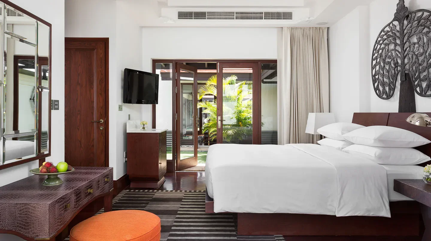 Elegant bedroom at Park Hyatt Siem Reap with garden views in Siem Reap