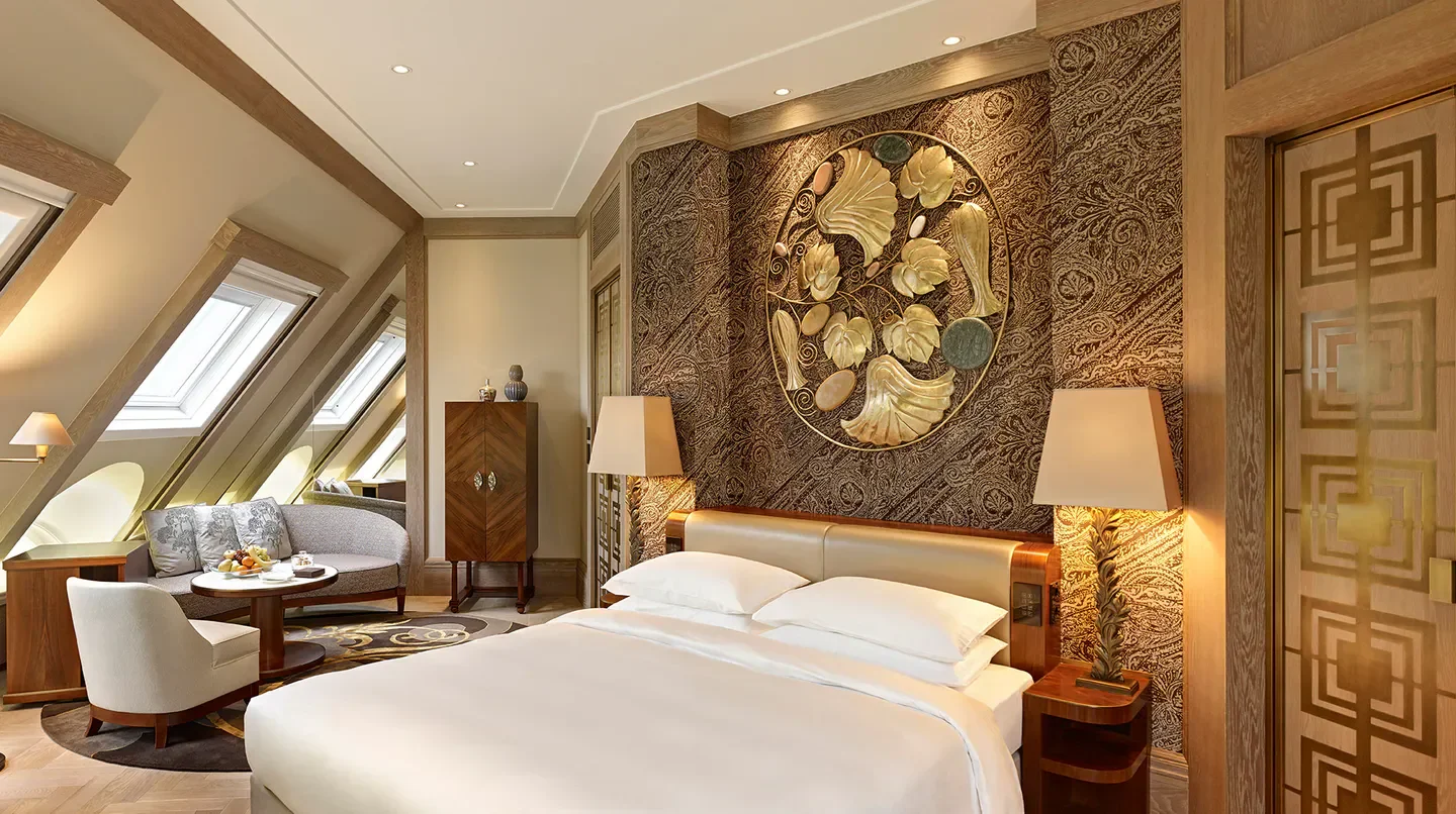 Elegant bedroom at Park Hyatt Vienna. Luxury hotel suite in Vienna, featuring stylish decor.