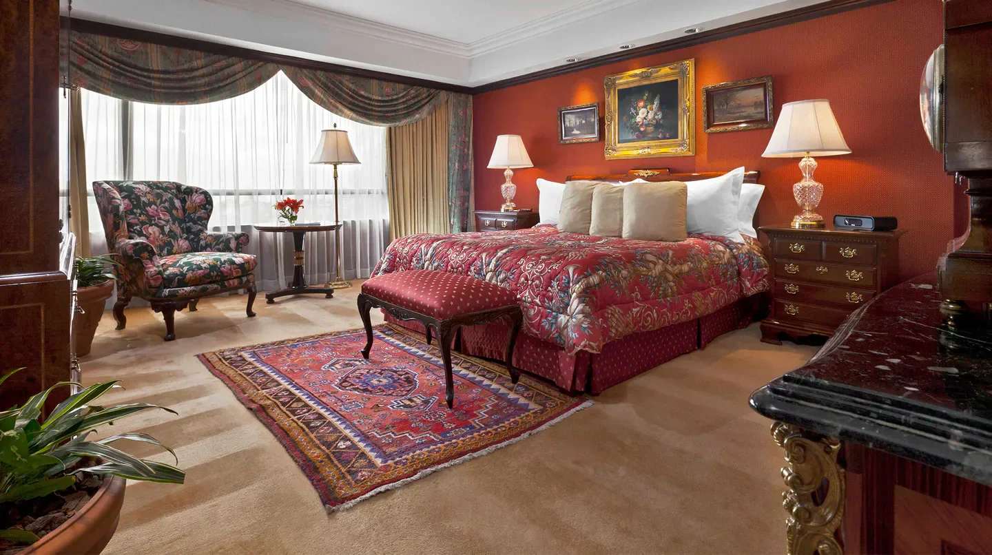 Elegant bedroom at Park Tower, A Luxury Collection Hotel in Buenos Aires with antique furniture.