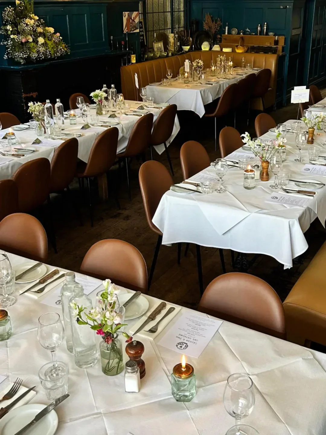 Elegant dining tables set for dinner at Parlour restaurant in London.