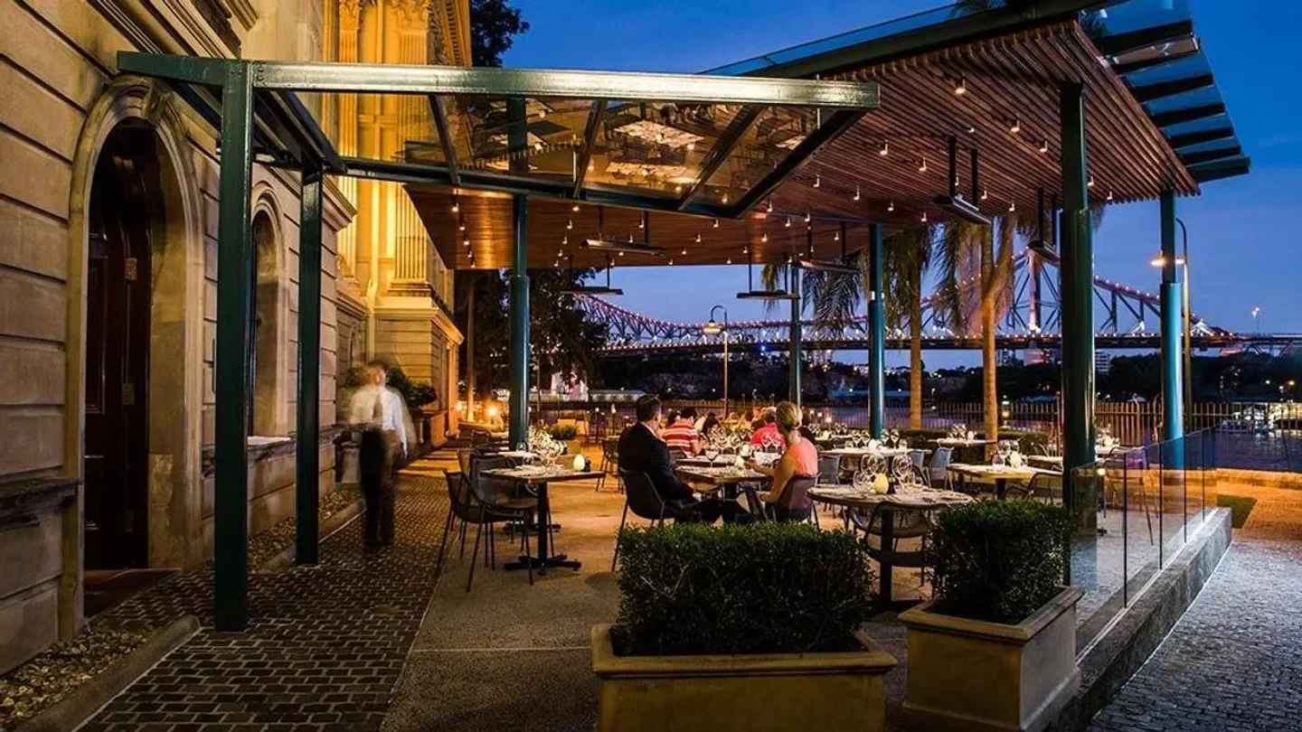 Outdoor dining at Patina at Customs House in Brisbane with Story Bridge view.