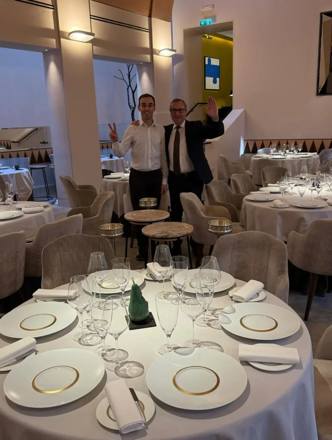 Elegant dining room at Patrick Guilbaud in Dublin, with staff greeting patrons.