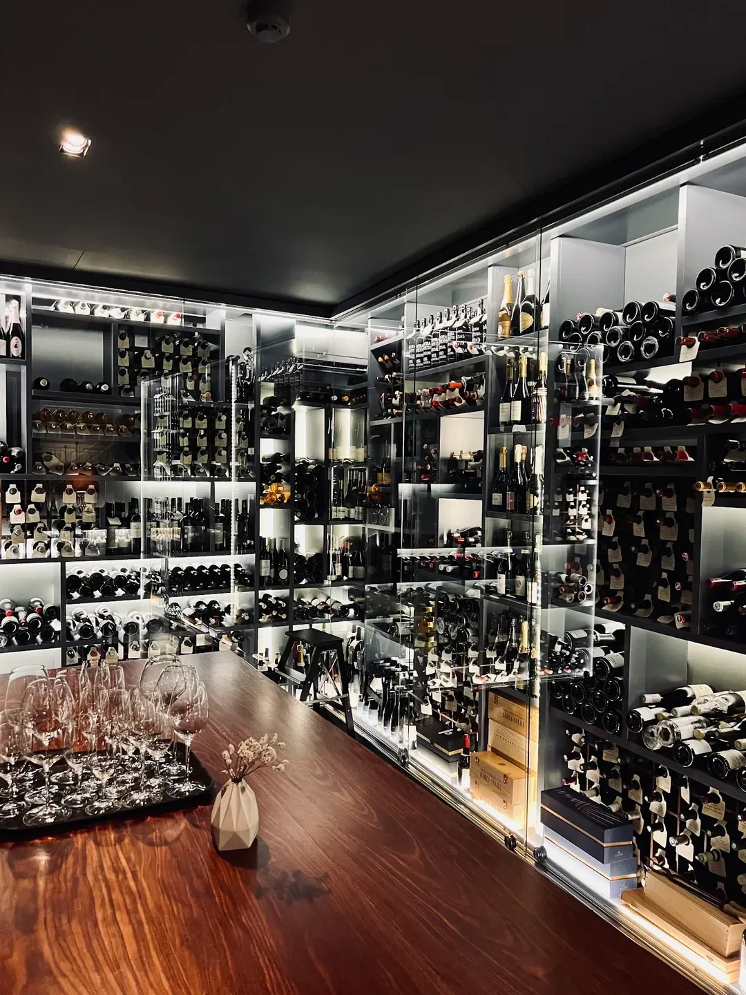 Wine cellar interior at Pedro Lemos restaurant in Porto, showcasing fine wine selection.