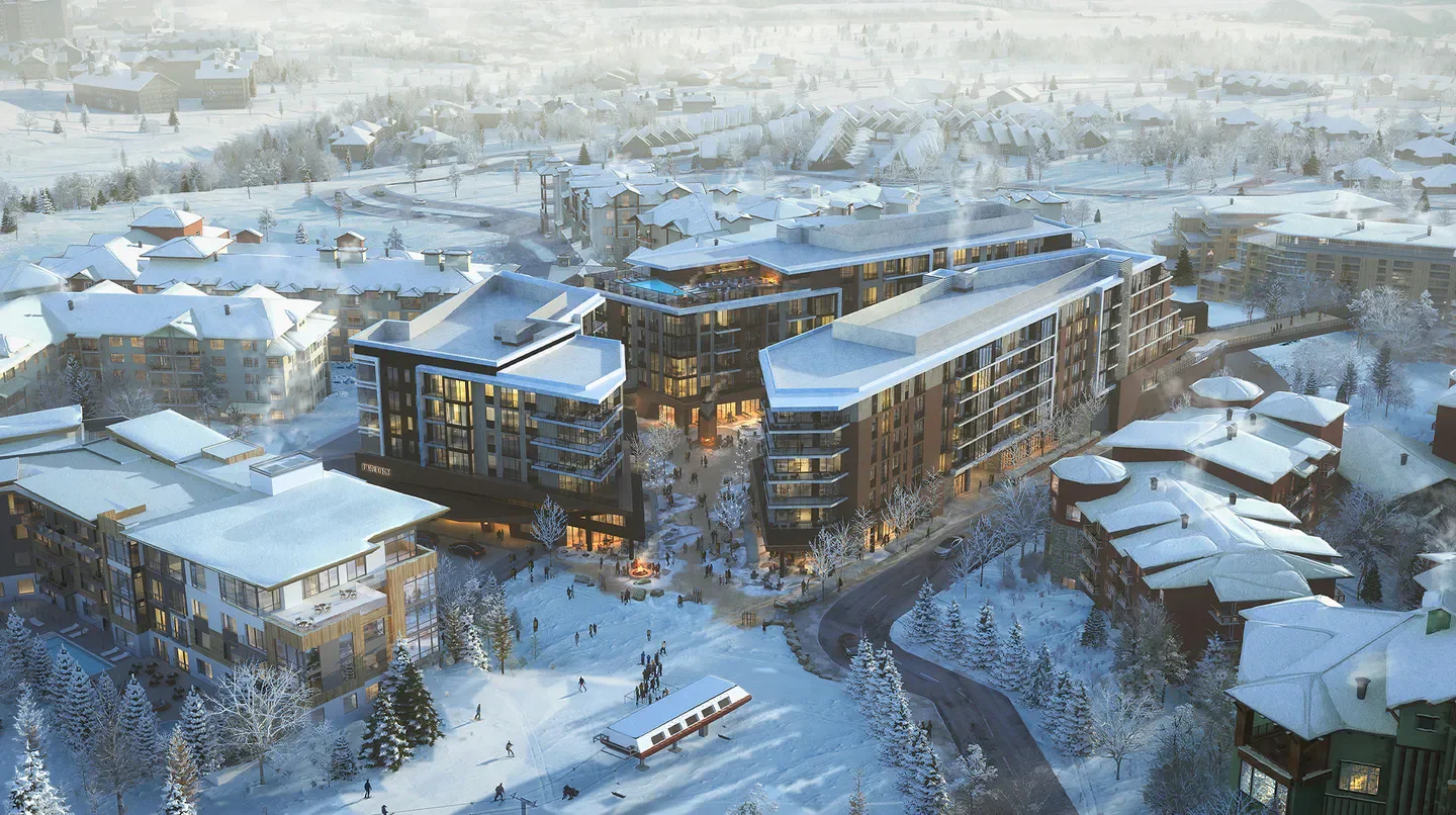 Aerial view of Pendry Park City surrounded by snow-covered buildings and winter landscape in Park City.