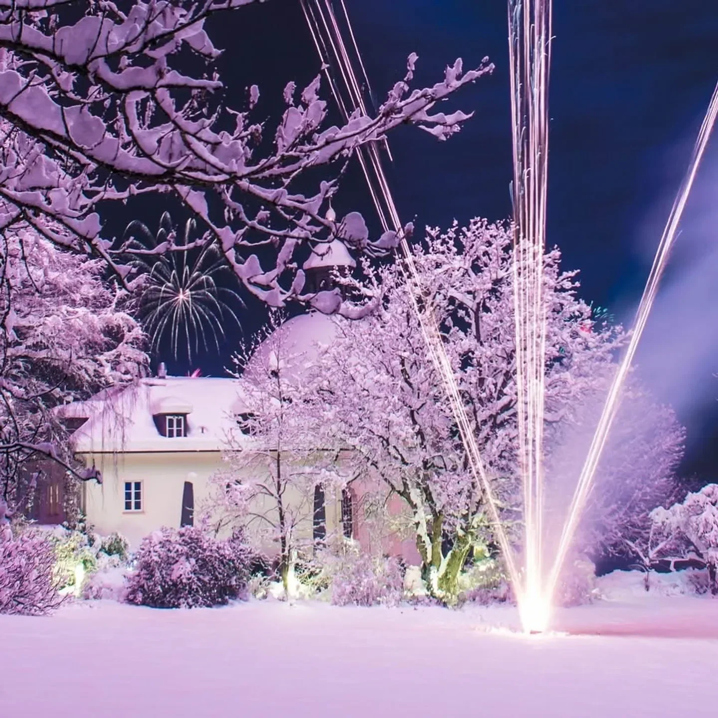 Winter wonderland at Pfefferschiff restaurant in Salzburg, with fireworks display at night