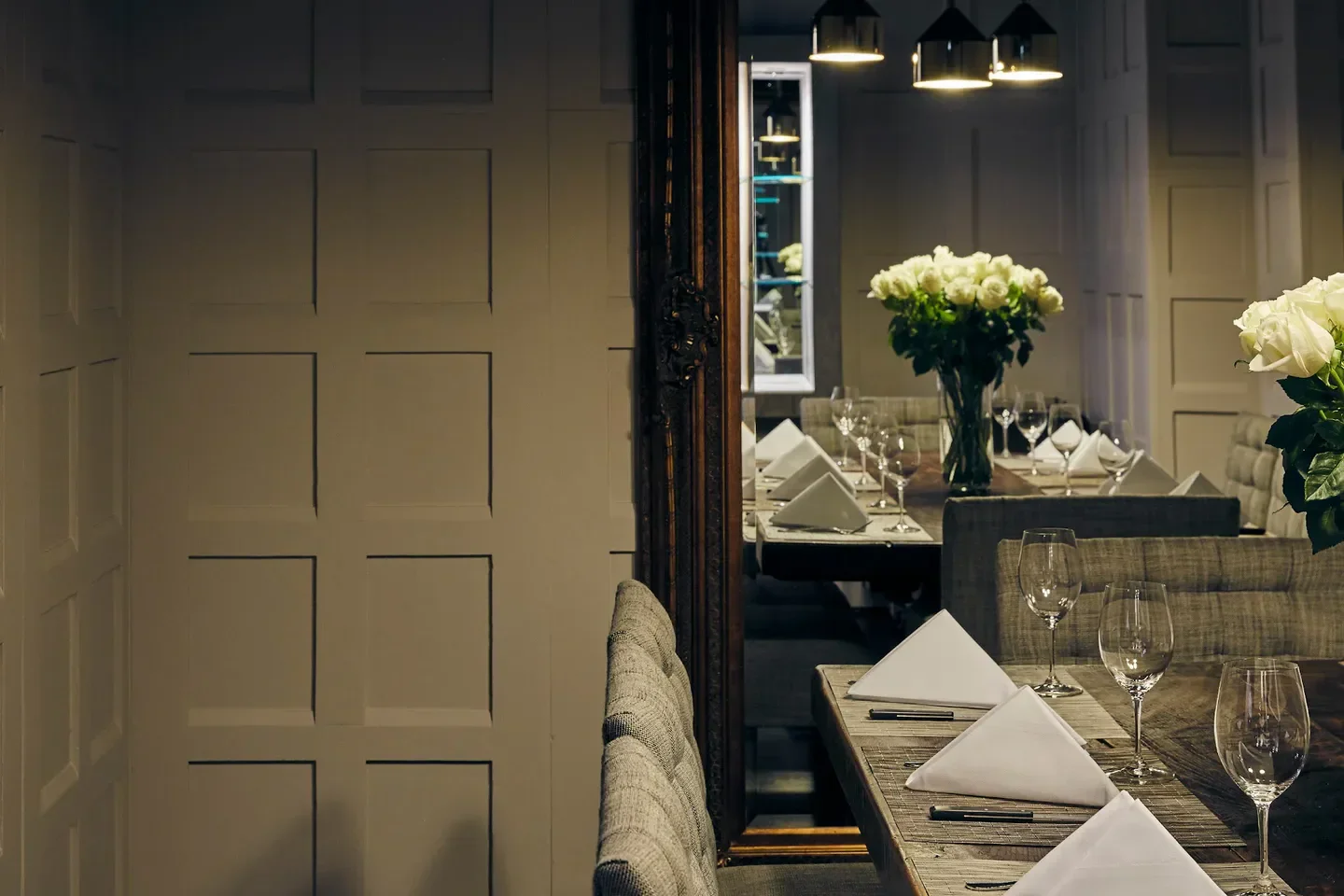 Elegant dining at Philippe restaurant in Melbourne with roses and table settings.
