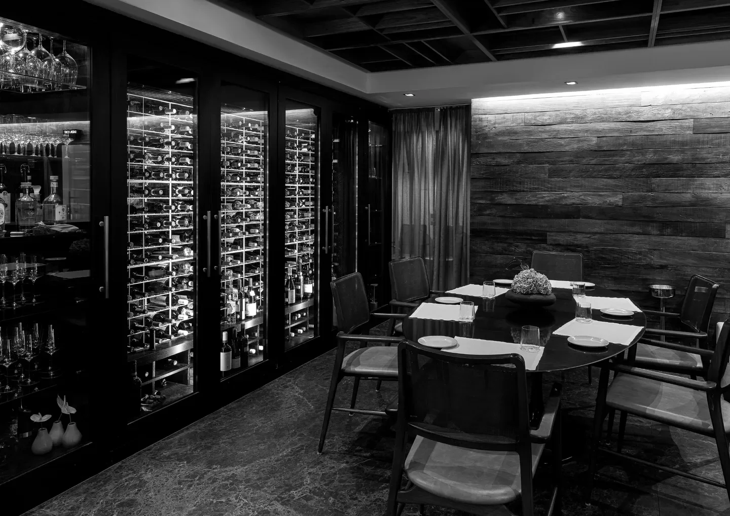Elegant dining room at Picchi restaurant in Sao Paulo with wine display.