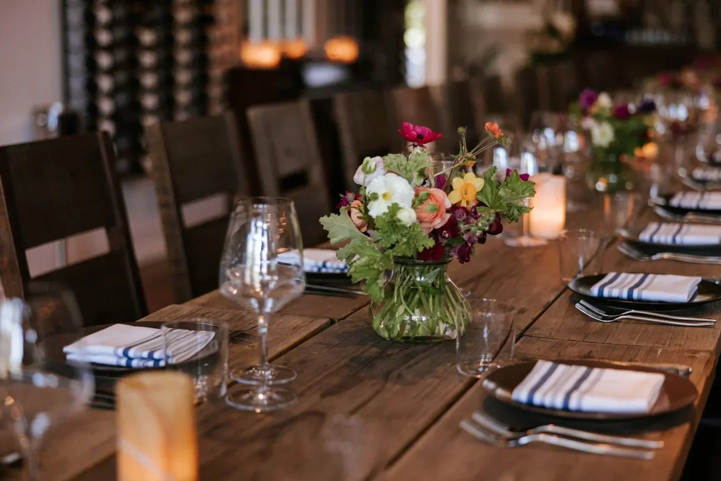 Elegant dining table at PICO Restaurant in the Santa Ynez Valley, with flowers and place settings.