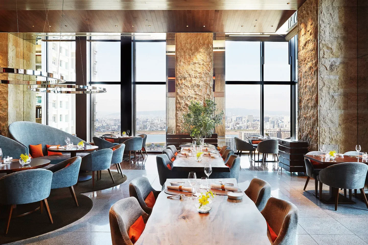 Dining area at Pierre - Osaka, featuring city views of Osaka through large windows.