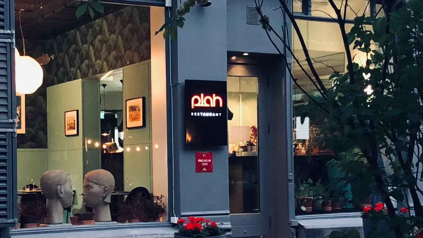 Exterior view of Plah Restaurant in Oslo, Norway, showcasing the restaurant's entrance and decor