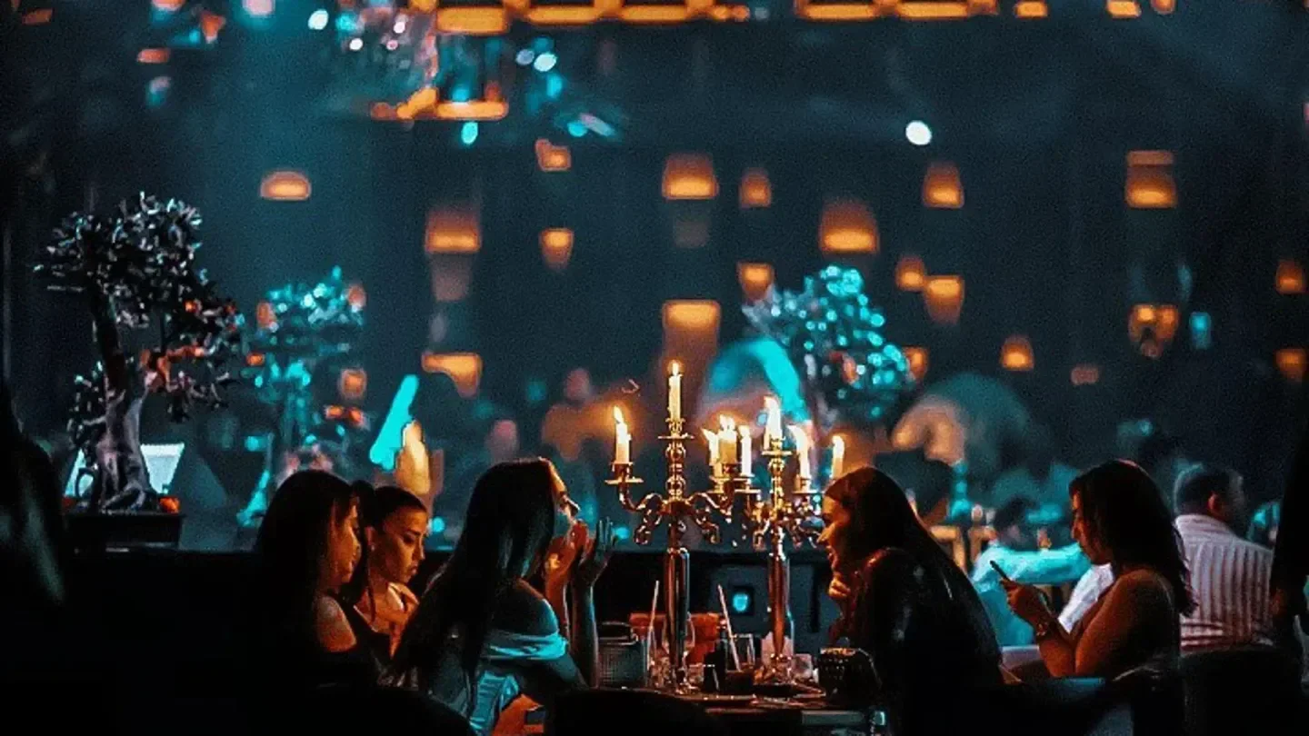 Candlelit tables at Play Dubai nightclub, featuring a stylish interior and a lively atmosphere.