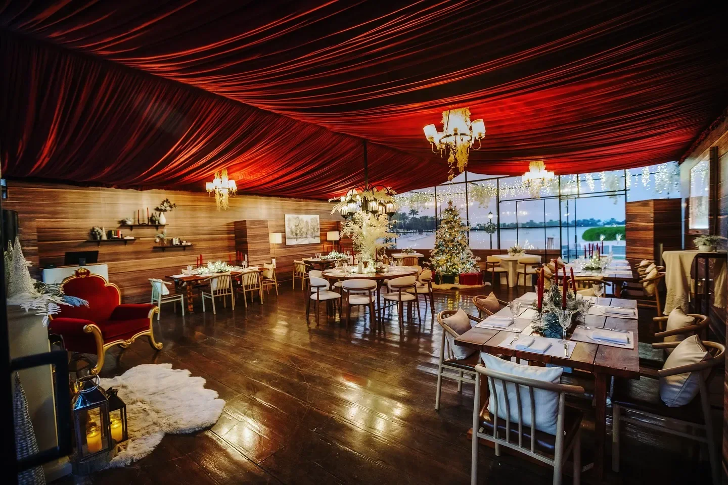 Elegant dining at PLUMS restaurant in Manama, featuring Christmas decor and stunning views.