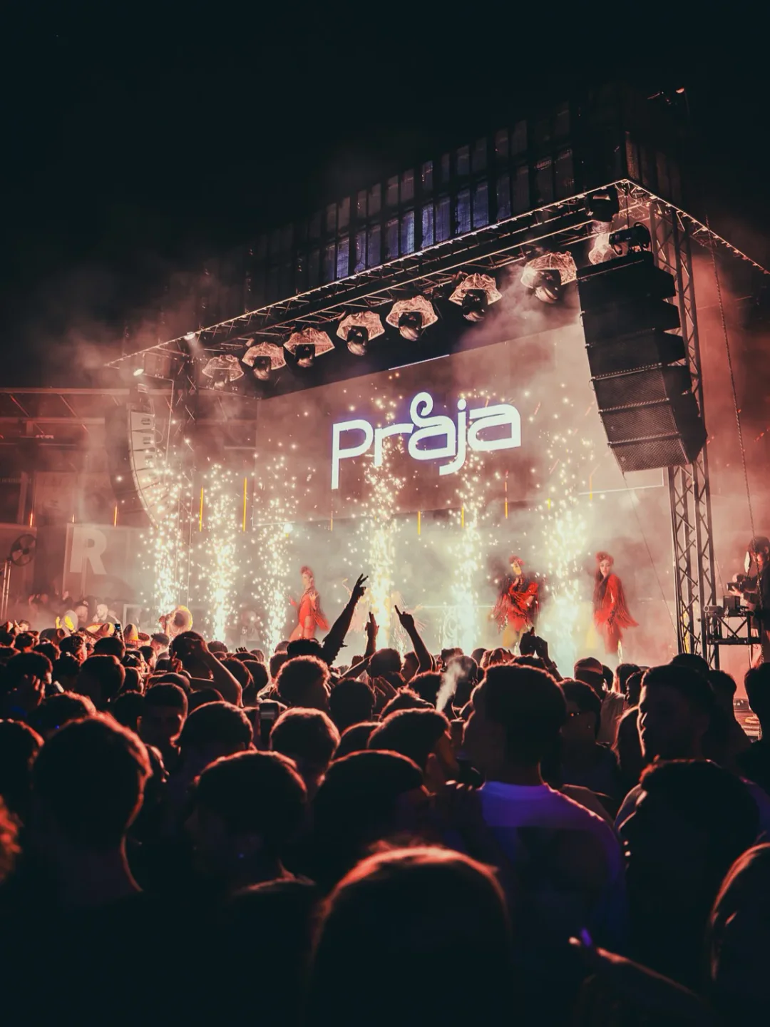 Praja Gallipoli nightclub in Puglia features energetic crowd with stage performers and fireworks