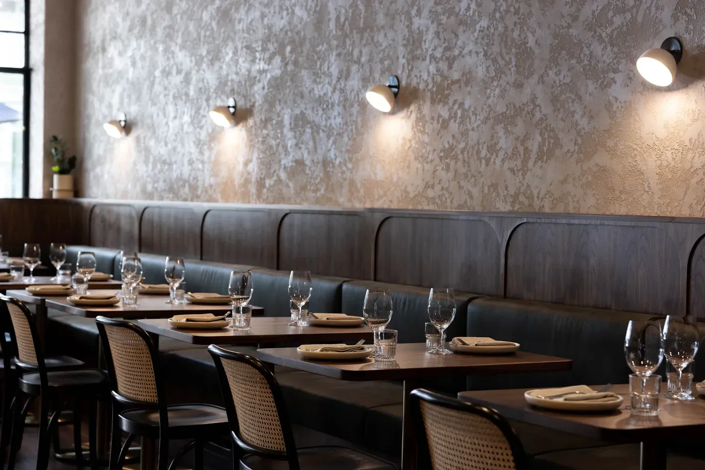Interior dining at Press Food & Wine in Adelaide, featuring tables, chairs and decor.
