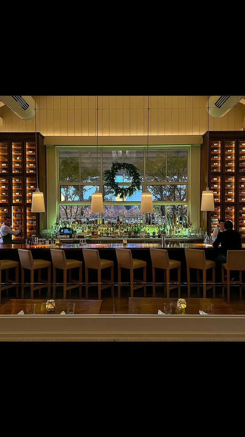 Interior bar at PRESS Restaurant in Napa Valley, featuring a wide selection of drinks.