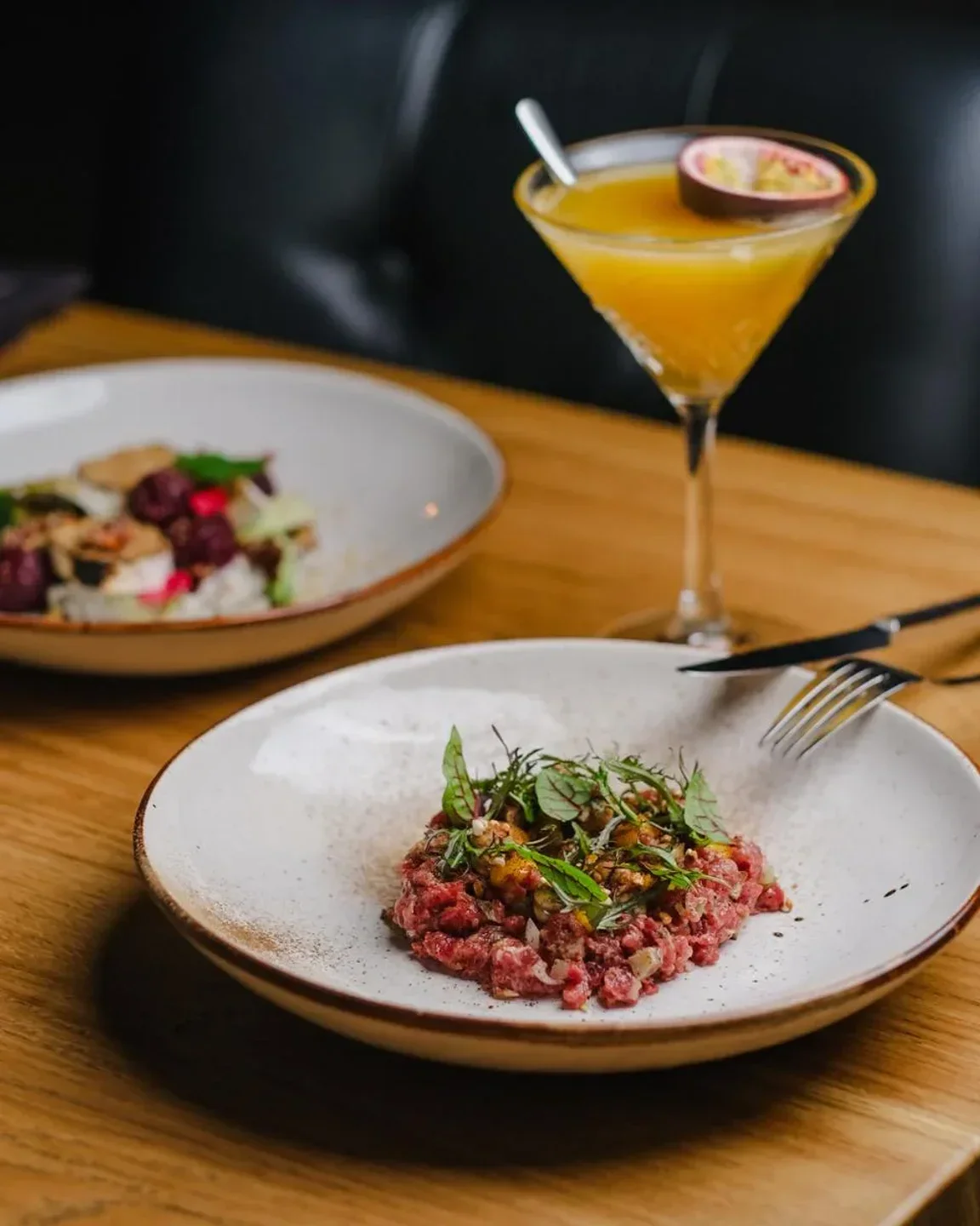 Delicious steak tartare and cocktail at Prime Cut restaurant in Warsaw.