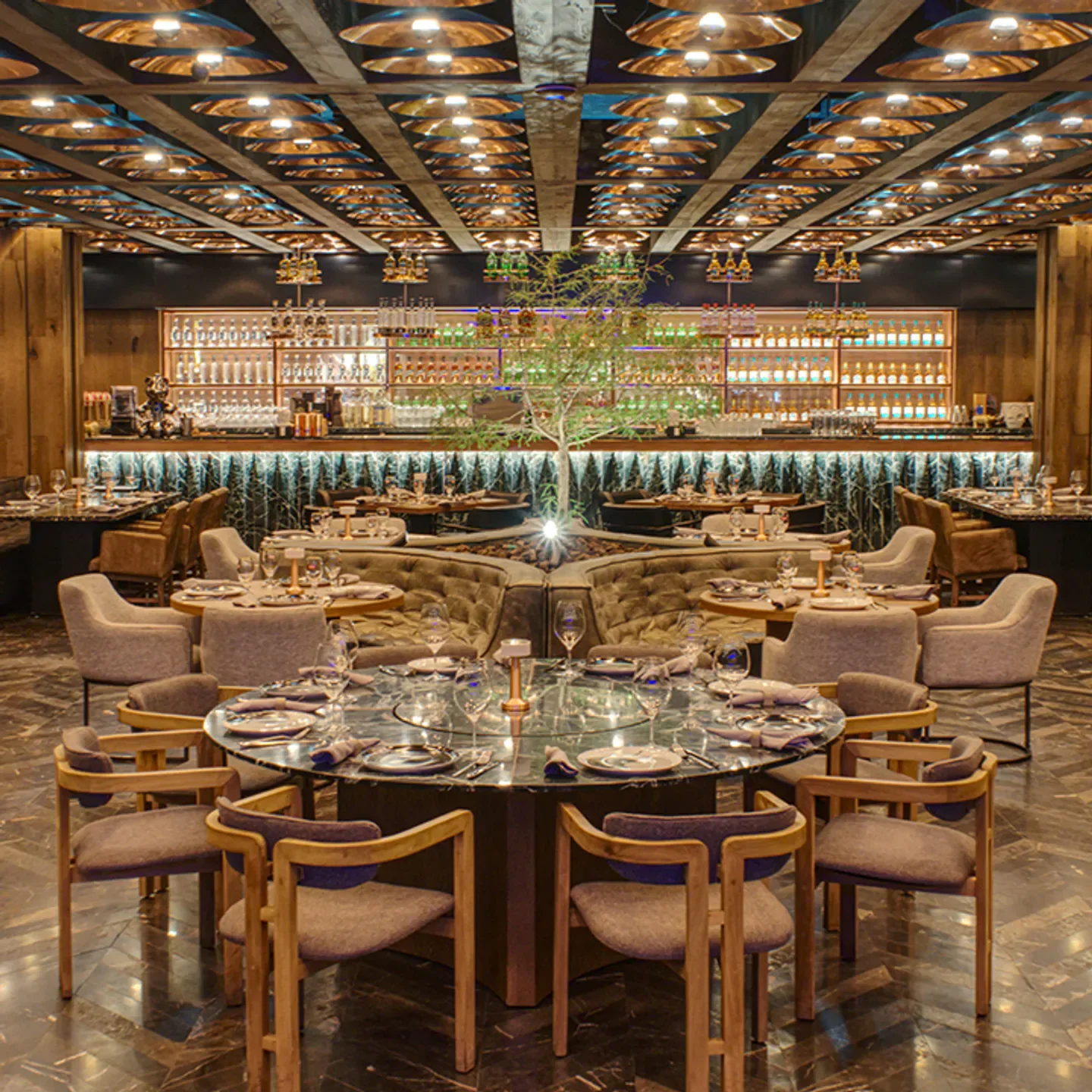 Interior of Prime Steak Club in Mexico City, showcasing elegant dining and bar area.