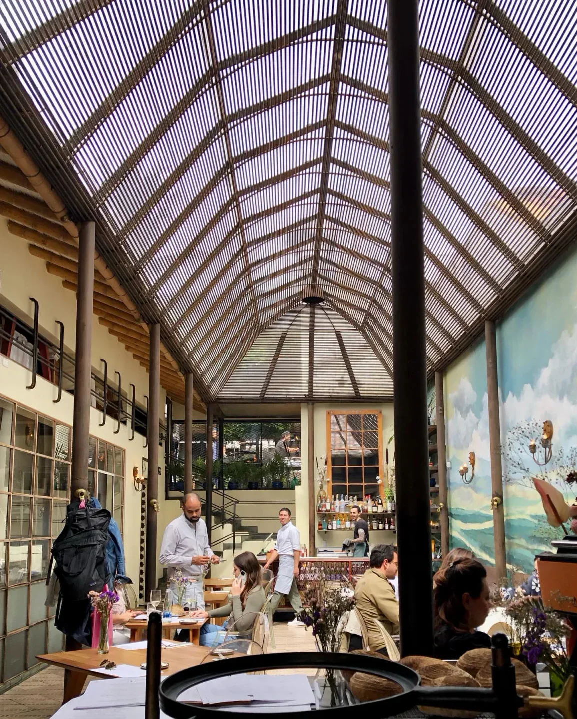 Interior view of Prudencia restaurant in Bogota, featuring unique ceiling and dining area