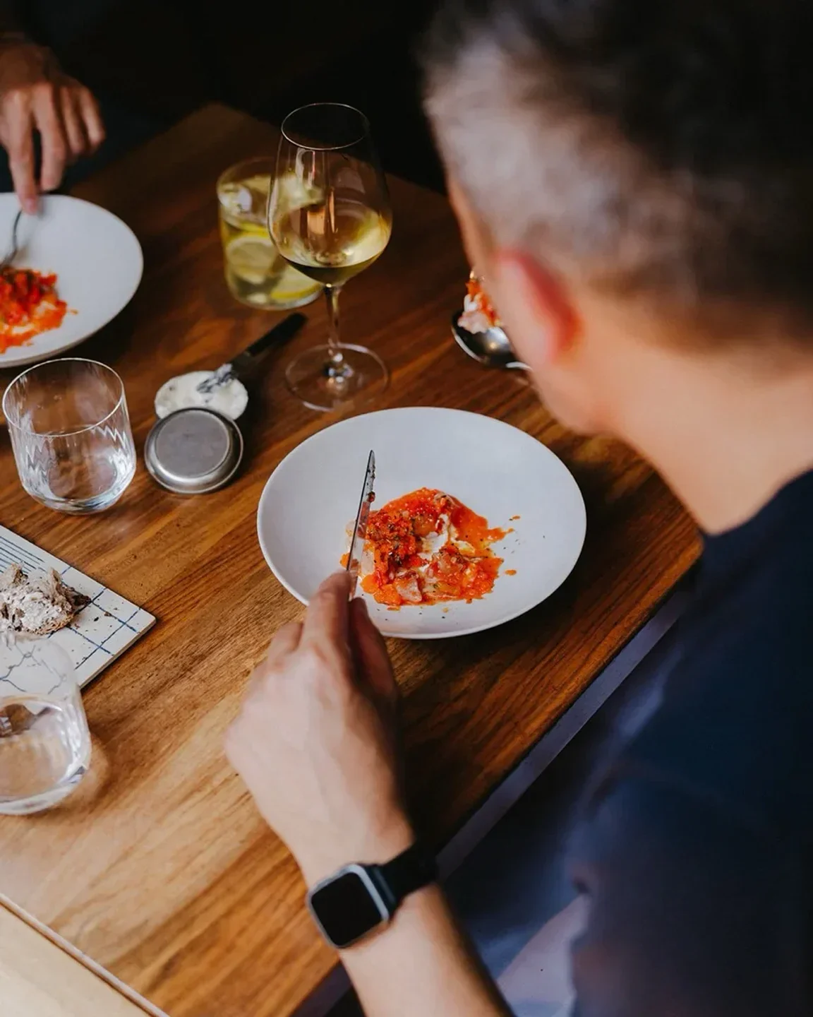 Dining at Publiek in Ghent: delicious meal served with a glass of wine.
