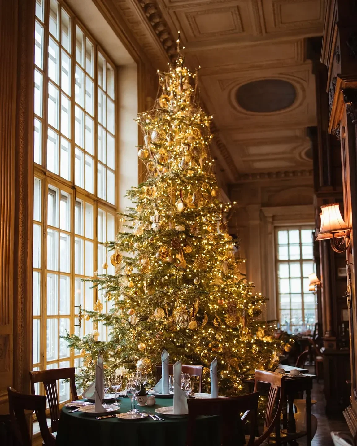 Festive Christmas tree at Pushkin restaurant in Moscow, ready for a holiday dinner