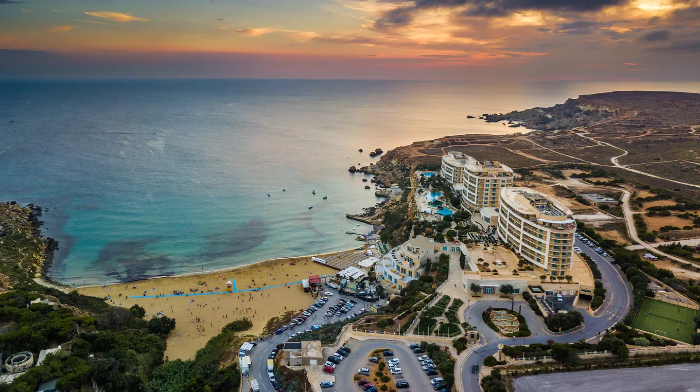 Aerial view of Radisson Blu Resort & Spa, Golden Sands in Malta, with beach and sea.