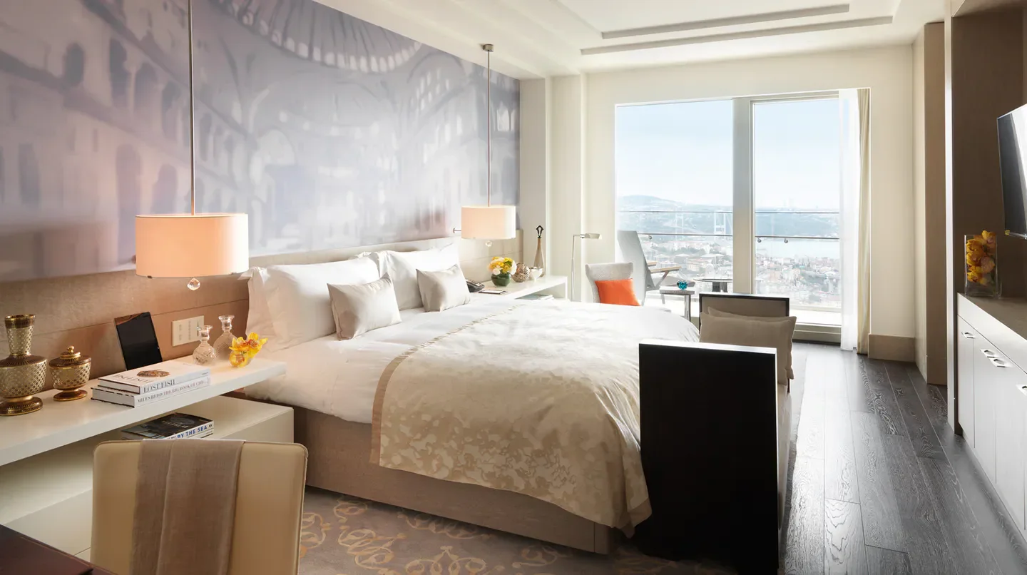 Luxury bedroom at Raffles Istanbul with city views, a perfect stay in Istanbul.