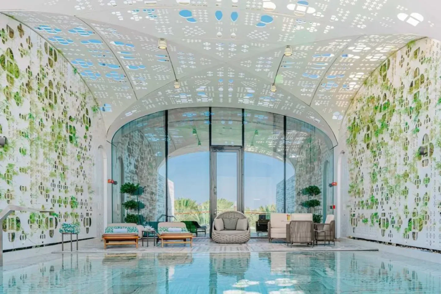 Raffles Spa Doha's tranquil pool area, a luxurious spa experience in Doha.