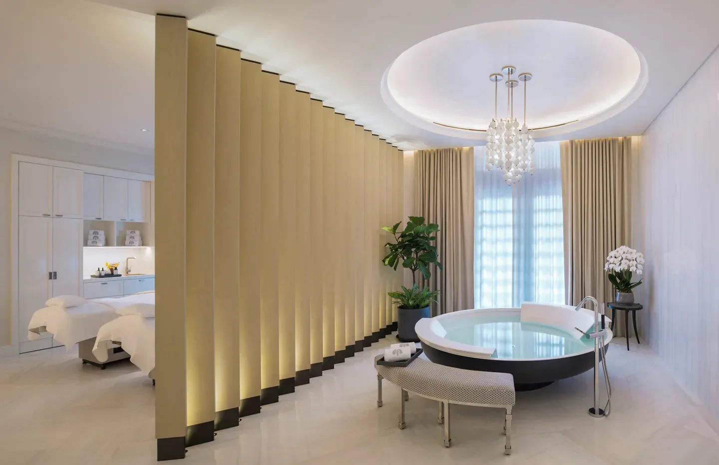 Raffles Spa in Singapore: Luxurious spa suite with a soaking tub and elegant design
