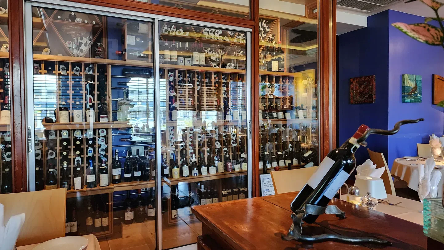 Wine display at Ragazzi Italian & Pizza Restaurant Cayman, Grand Cayman. Restaurant interior.